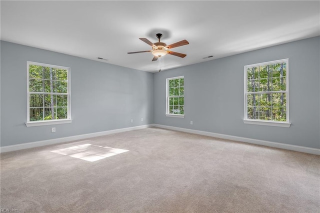 carpeted empty room with ceiling fan