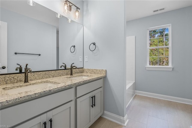 bathroom with vanity and shower / bathtub combination