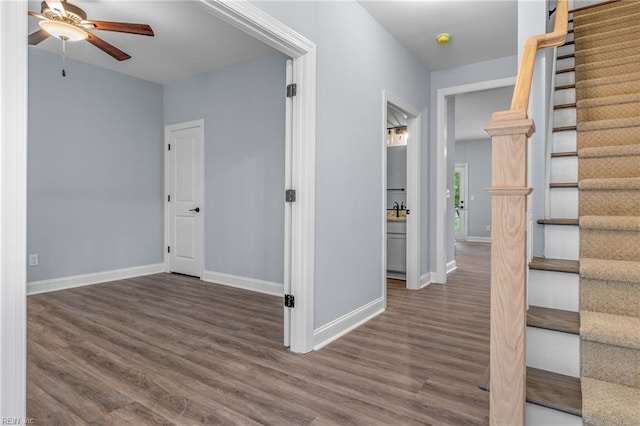 hall with dark hardwood / wood-style floors