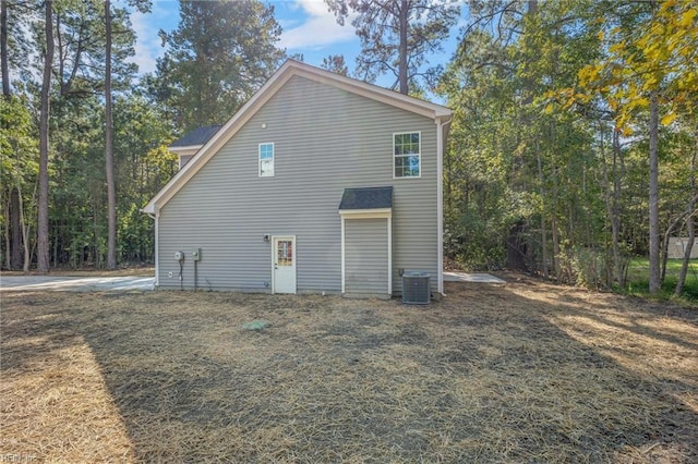 view of side of home with central air condition unit