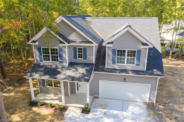 craftsman-style home with covered porch and a garage