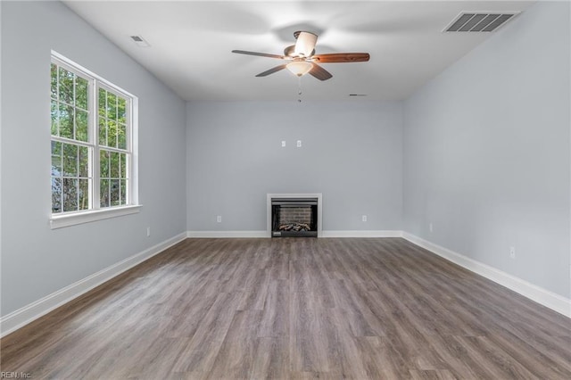 unfurnished living room with hardwood / wood-style floors and ceiling fan