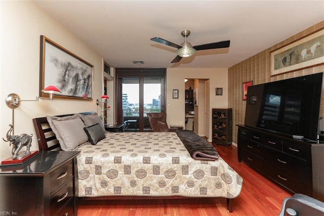 bedroom featuring ceiling fan and hardwood / wood-style flooring