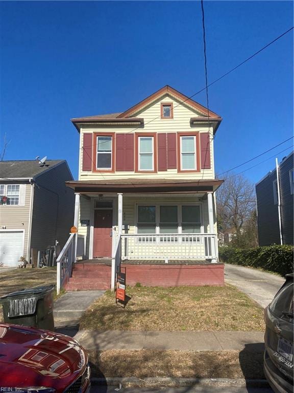 view of front of house with a garage and covered porch