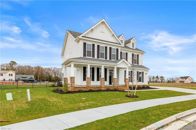 view of front of house featuring a front lawn and a porch