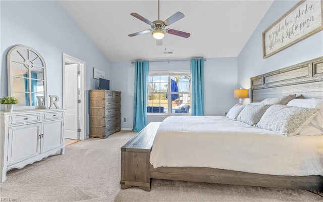 bedroom with ceiling fan, light carpet, and lofted ceiling