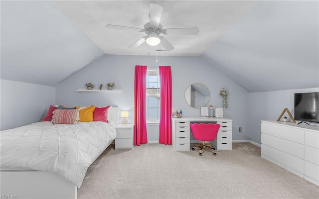 carpeted bedroom featuring ceiling fan and vaulted ceiling