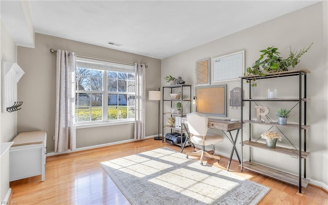 home office featuring light hardwood / wood-style floors