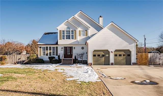 view of front property with a front yard and a garage