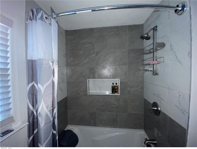 bathroom featuring shower / bath combination with curtain