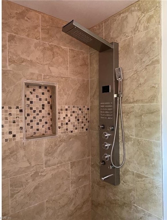 details featuring tiled shower