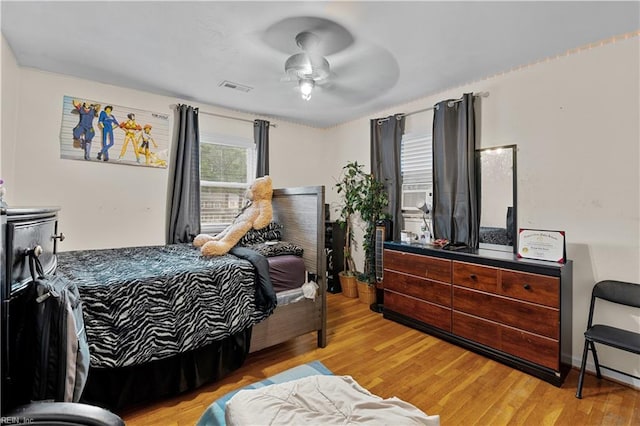 bedroom featuring ceiling fan and light hardwood / wood-style floors