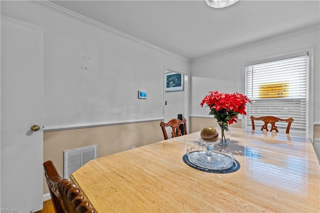 dining room featuring ornamental molding