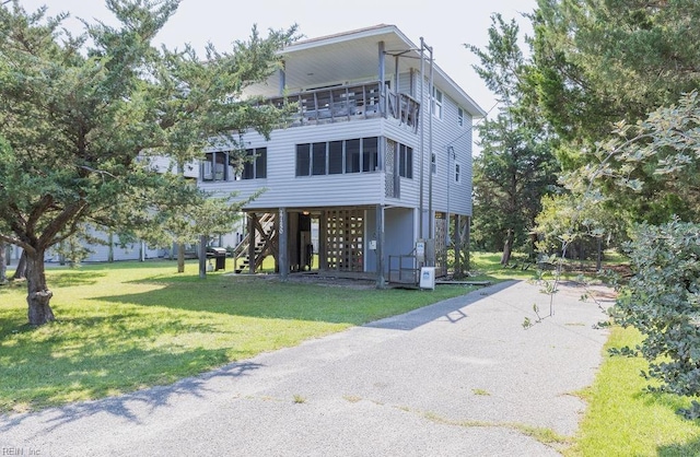 exterior space with a front yard and a carport