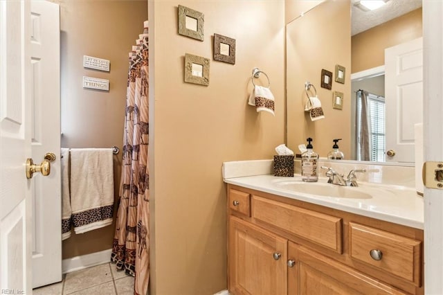 bathroom featuring tile patterned floors and vanity