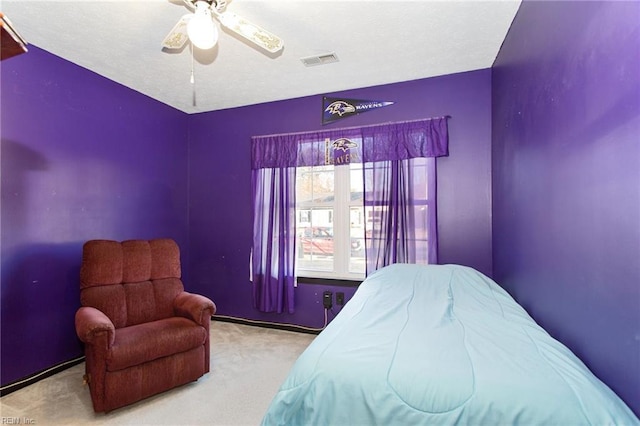 carpeted bedroom with ceiling fan