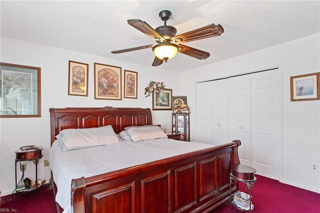 bedroom with ceiling fan, a closet, and dark carpet