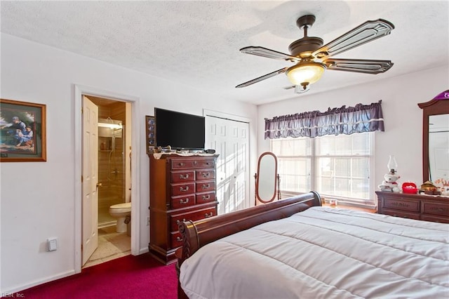 bedroom with a textured ceiling, ceiling fan, a closet, carpet floors, and ensuite bath