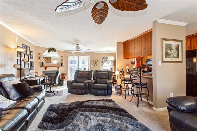 carpeted living room featuring a textured ceiling, ceiling fan, and crown molding