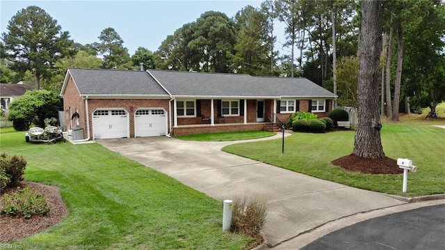 single story home with a garage and a front lawn