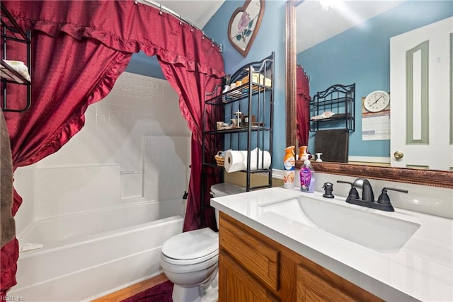 full bathroom featuring toilet, vanity, and shower / tub combo with curtain