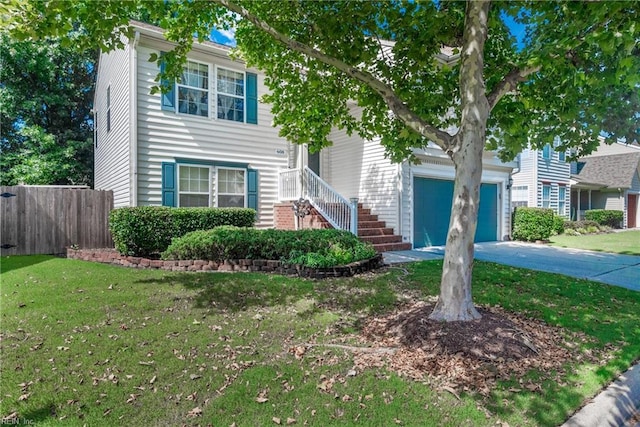 view of front of house with a front lawn and a garage