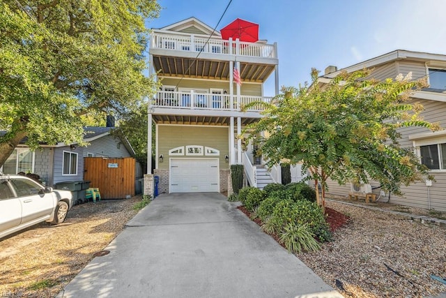 view of front of home with a balcony and a garage