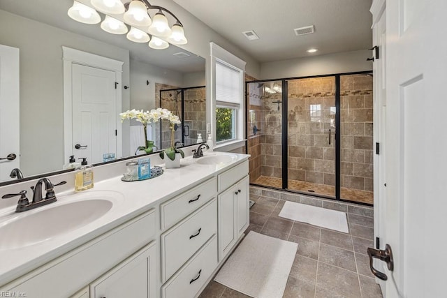 bathroom featuring an enclosed shower and vanity