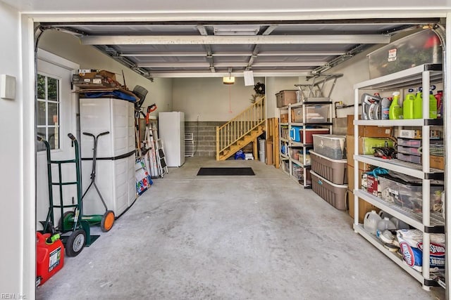 garage featuring white fridge