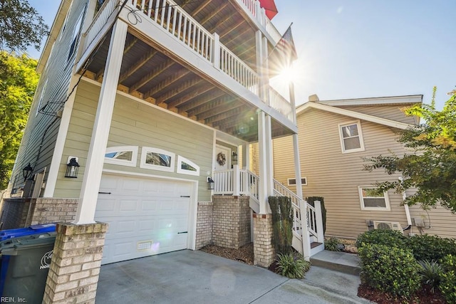 view of front of house with a balcony and a garage