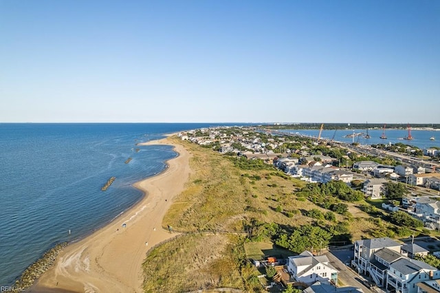 drone / aerial view with a beach view and a water view