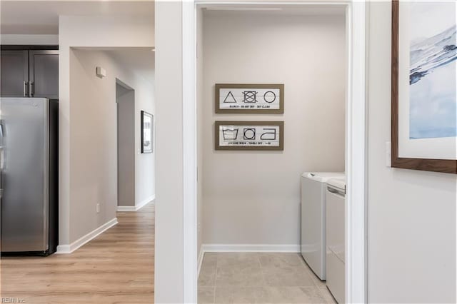 laundry room featuring separate washer and dryer