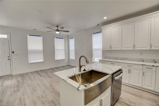 kitchen with white cabinetry, light hardwood / wood-style floors, and dishwasher