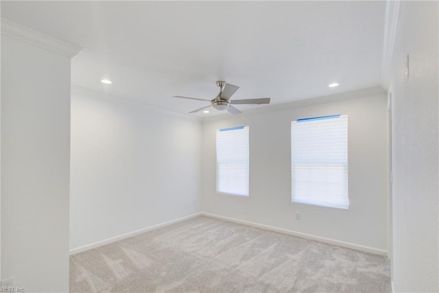 unfurnished room with light carpet, ceiling fan, and ornamental molding