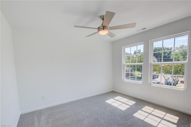 empty room featuring ceiling fan and carpet flooring