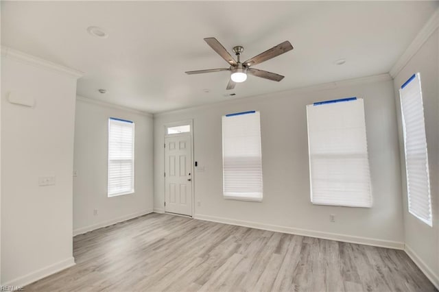 interior space with ceiling fan, light wood-type flooring, and crown molding