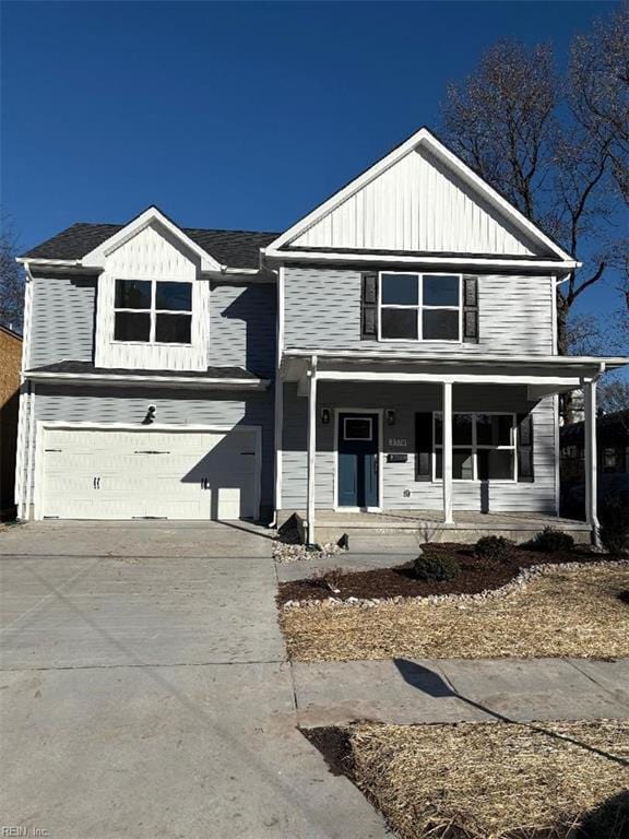 view of front property featuring covered porch and a garage