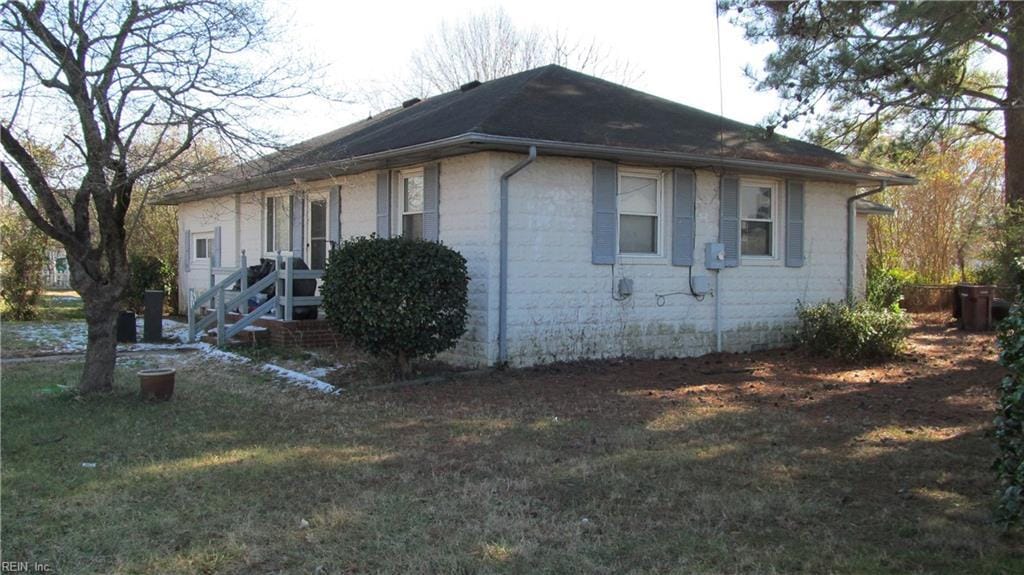 view of property exterior featuring a yard