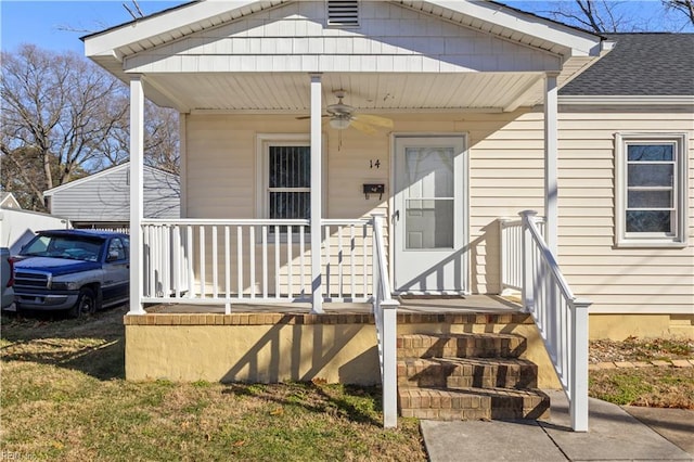 doorway to property featuring a porch and ceiling fan