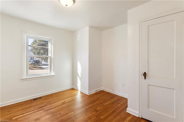 empty room featuring hardwood / wood-style floors