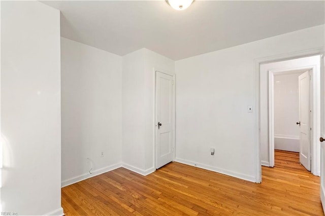 empty room with light hardwood / wood-style floors