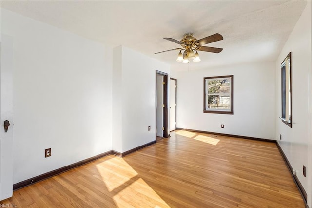 unfurnished room with ceiling fan and light hardwood / wood-style floors