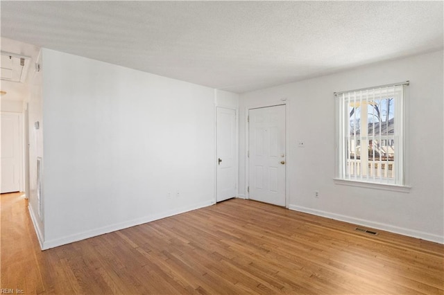 unfurnished room featuring light wood-type flooring