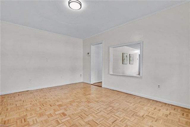 unfurnished room featuring light parquet floors and crown molding