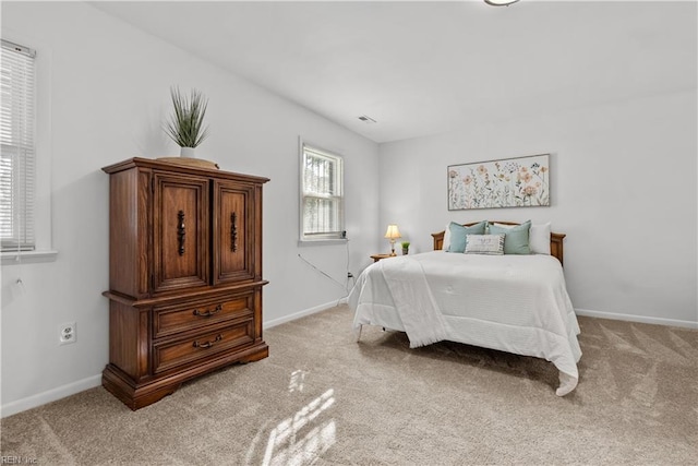 bedroom with light colored carpet