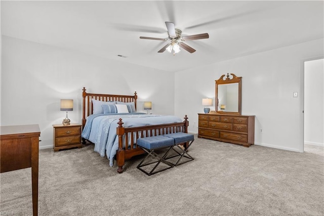 bedroom with ceiling fan and light carpet