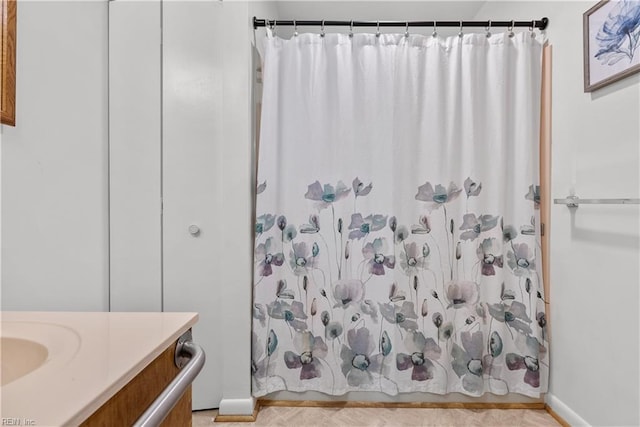 bathroom featuring vanity and shower / bath combo