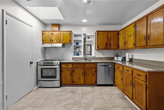 kitchen featuring appliances with stainless steel finishes, a skylight, and sink