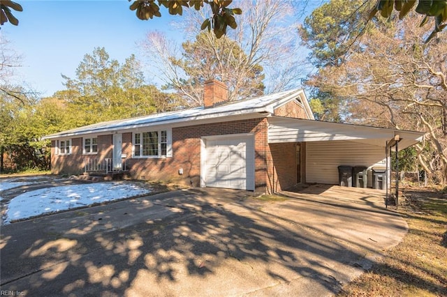 view of front of property with a garage and a carport