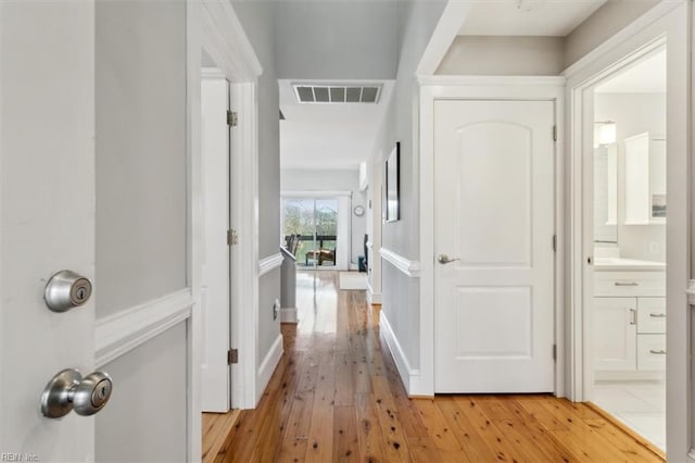 corridor featuring light wood-type flooring